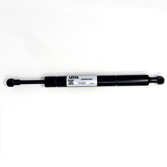 Black cylindrical steering damper with mounting joints, part data for WorldLawn replacement